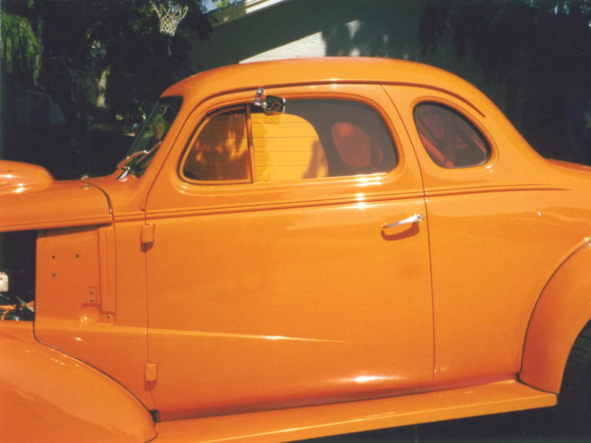 hotrod-car-with-orange-window-tint 1947 orange hotrod coupe with orange tinted windows.